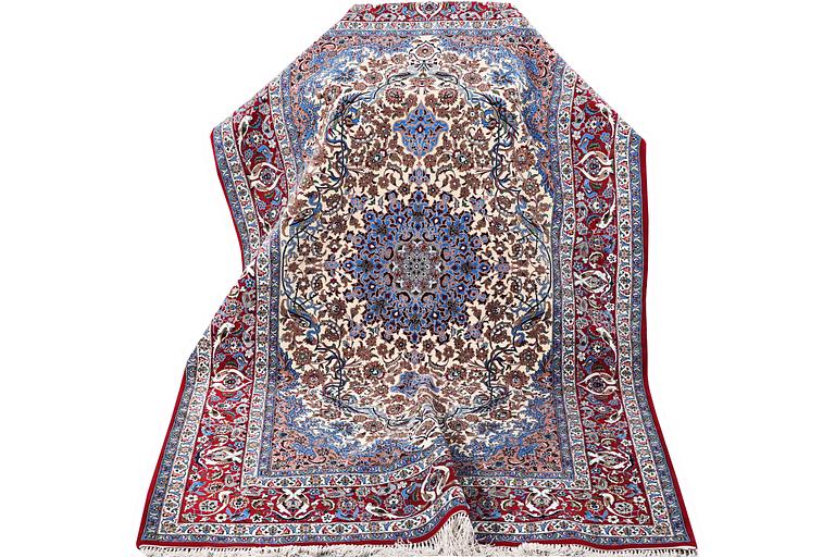 An Esfahan rug, part silk, figural, c. 243 x 158 cm.