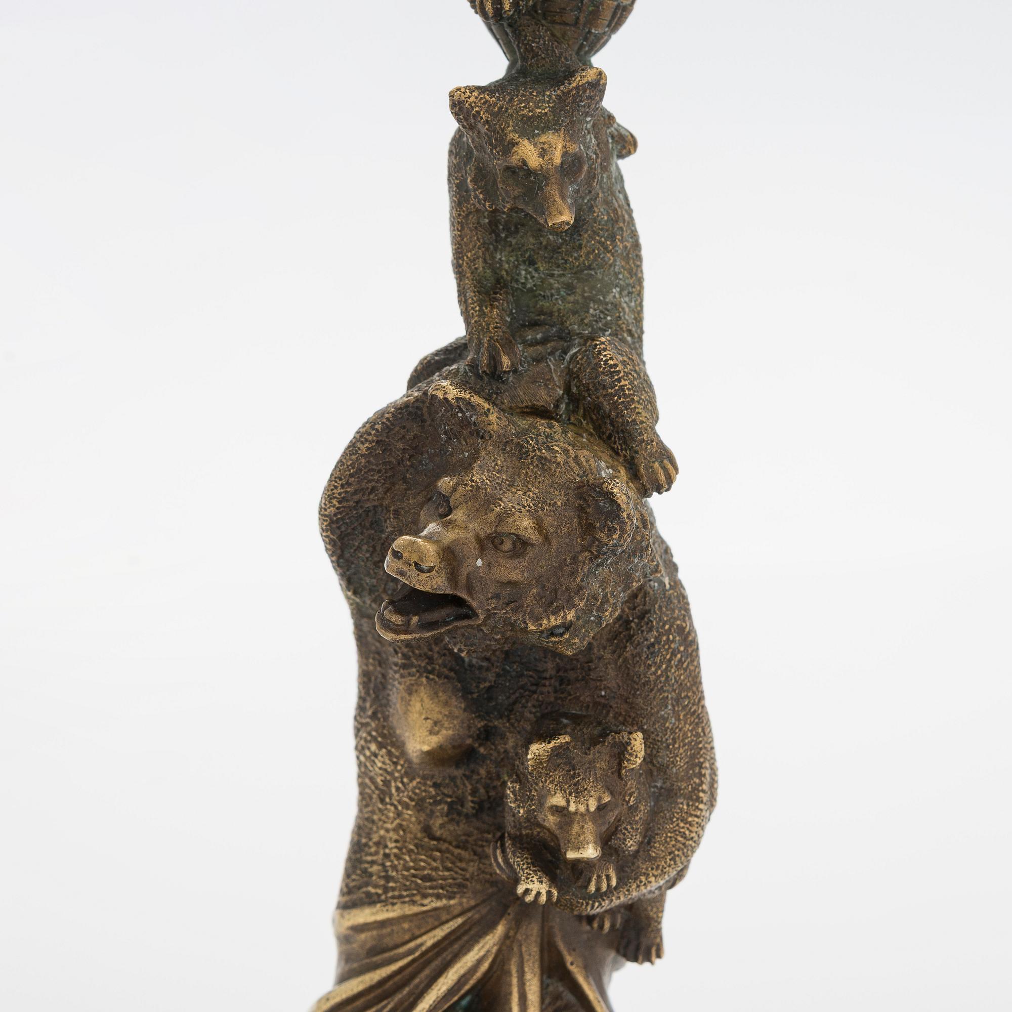 A Russian bronze candle holder, circa 1900.