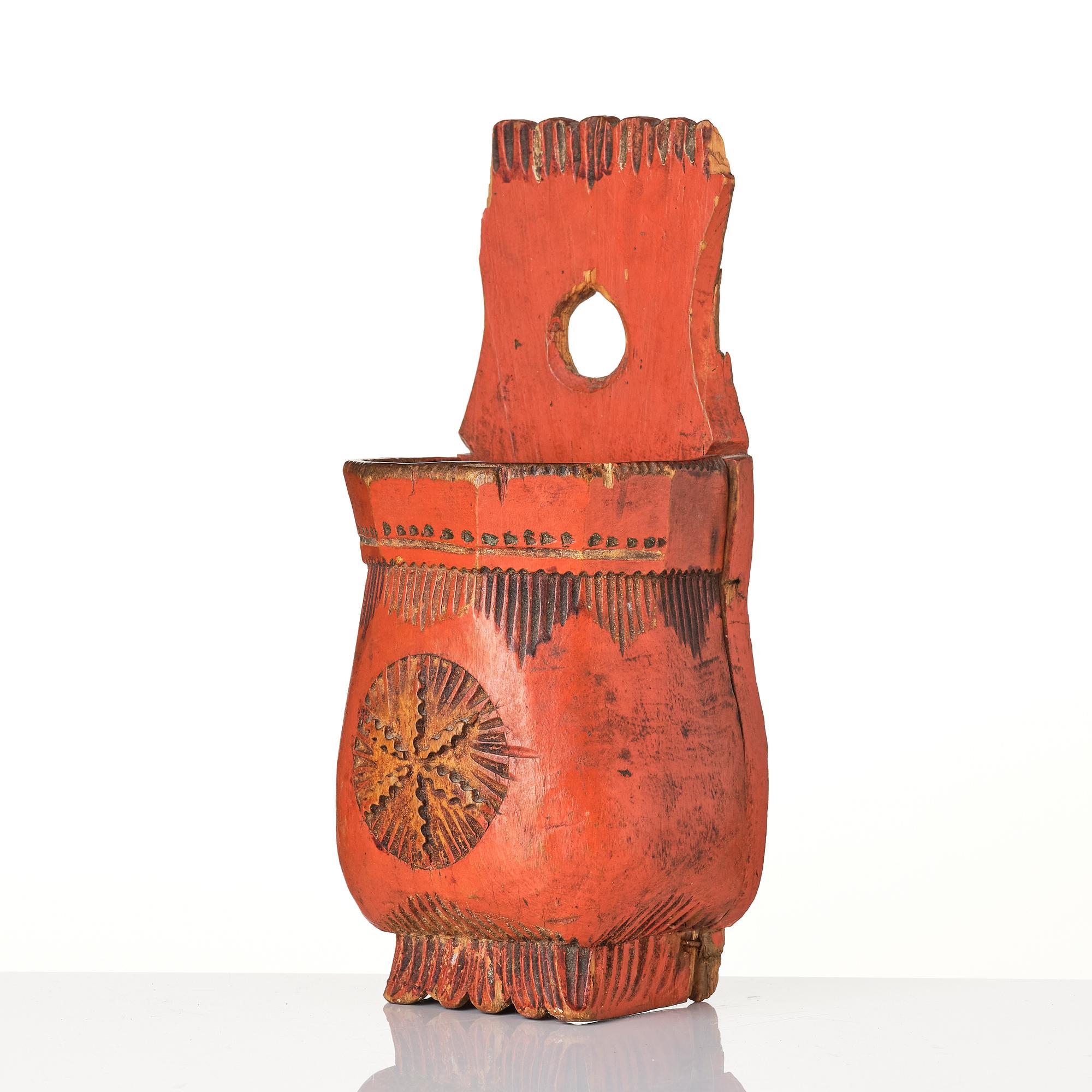A Swedish folk art carved and painted spoon holder, 18th century.