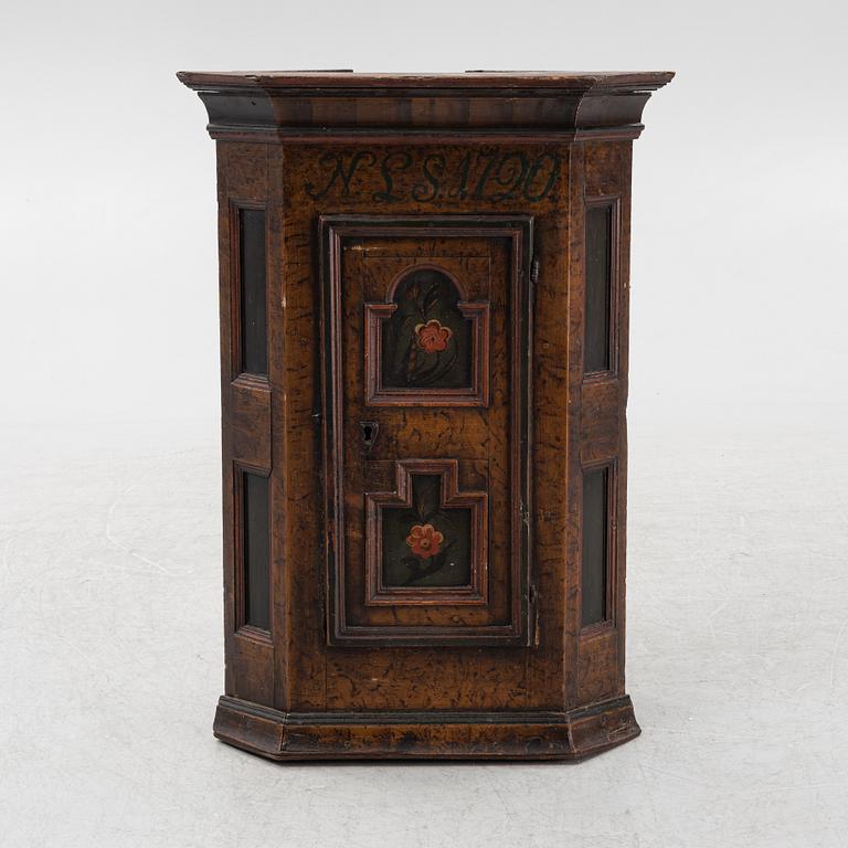 A Swedish provincial wall-hanged corner cabinet, dated 1790.