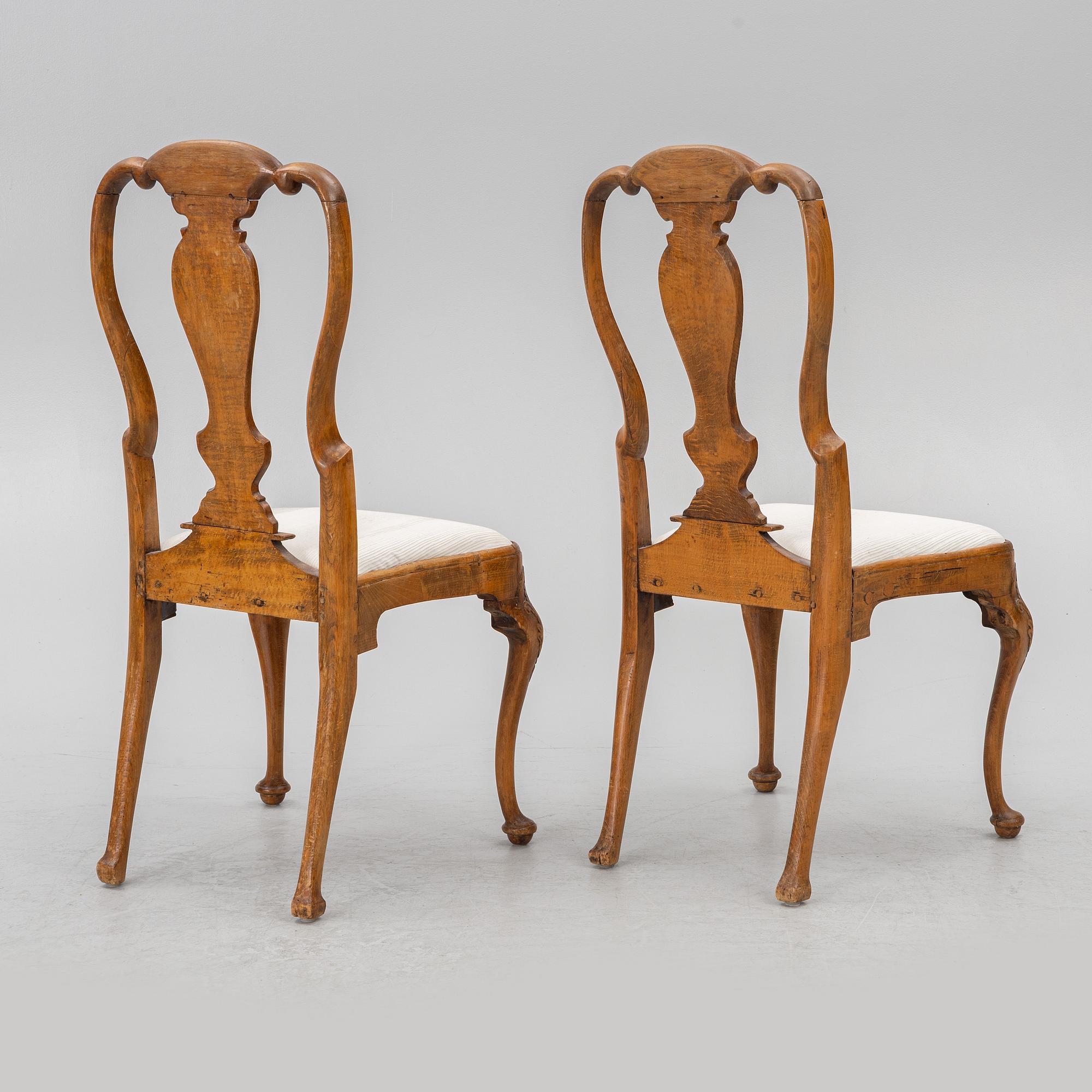 A pair of Swedish late baroque chairs, mid 18th century.
