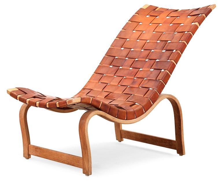 A Bruno Mathsson birch and brown leather lounge chair, model 36, Karl Mathsson, Värnamo 1939.