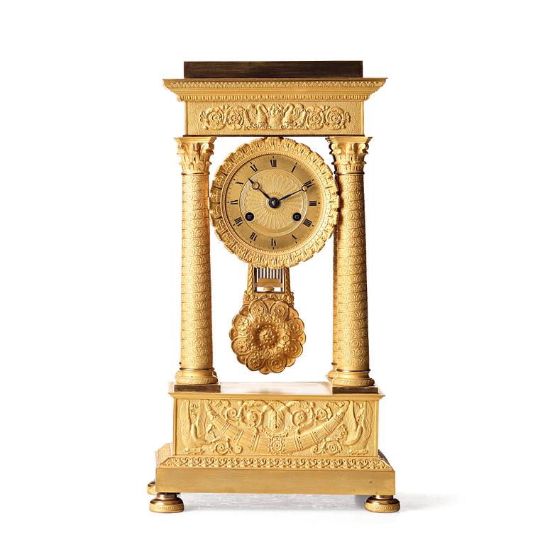 A Empire early 19th century gilt bronze mantel clock.