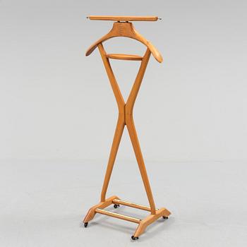 A late 20th century Fratelli Reguitti stand for men's clothes.