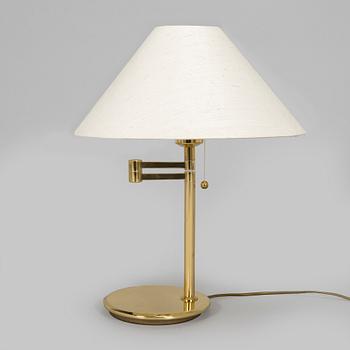 A 1970s/80s brass floor lamp, wall lamp and table lamp.