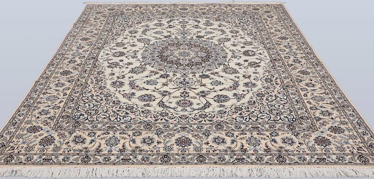 A Nain part silk carpet, 269 x 213 cm.