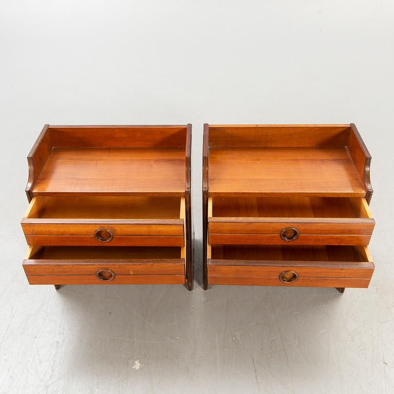 A pair of Italien 1950s/second half mahogany bedside tables.
