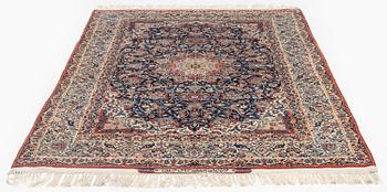 A semi-antique Isfahan rug, signed (Sadegh) Seirafian, c. 244 x 149 cm.