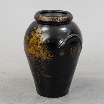A 20th Century earhten ware urn.