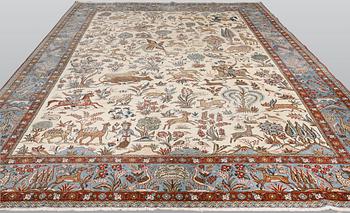 A semi-antique Ghom carpet, approx. 390 x 290 cm.