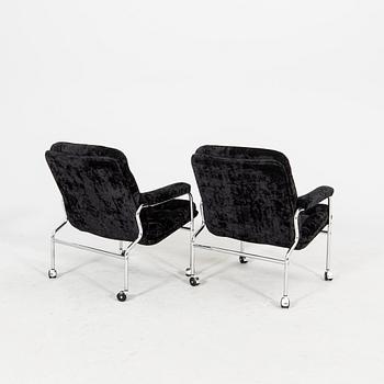 A pair of chrome and fabric 1970/80s armchairs.