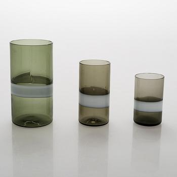 A glass carafe with 9 drinking glasses. The carafe signed Venini, Murano ITALIA.