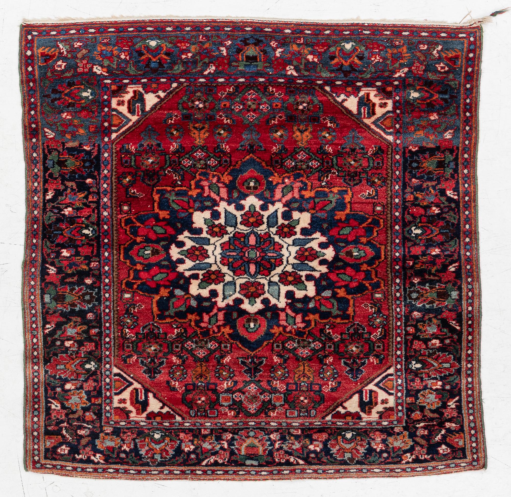 An Old Northwest Persian rug, c. 127 x 125 cm.