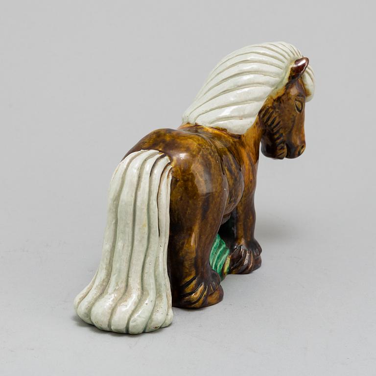 GUNNAR NYLUND, a chamotte stoneware figurine of a horse, from Rörstrand.