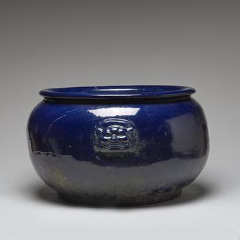 A large blue glazed flower pot/censer, presumably late Qing dynasty.