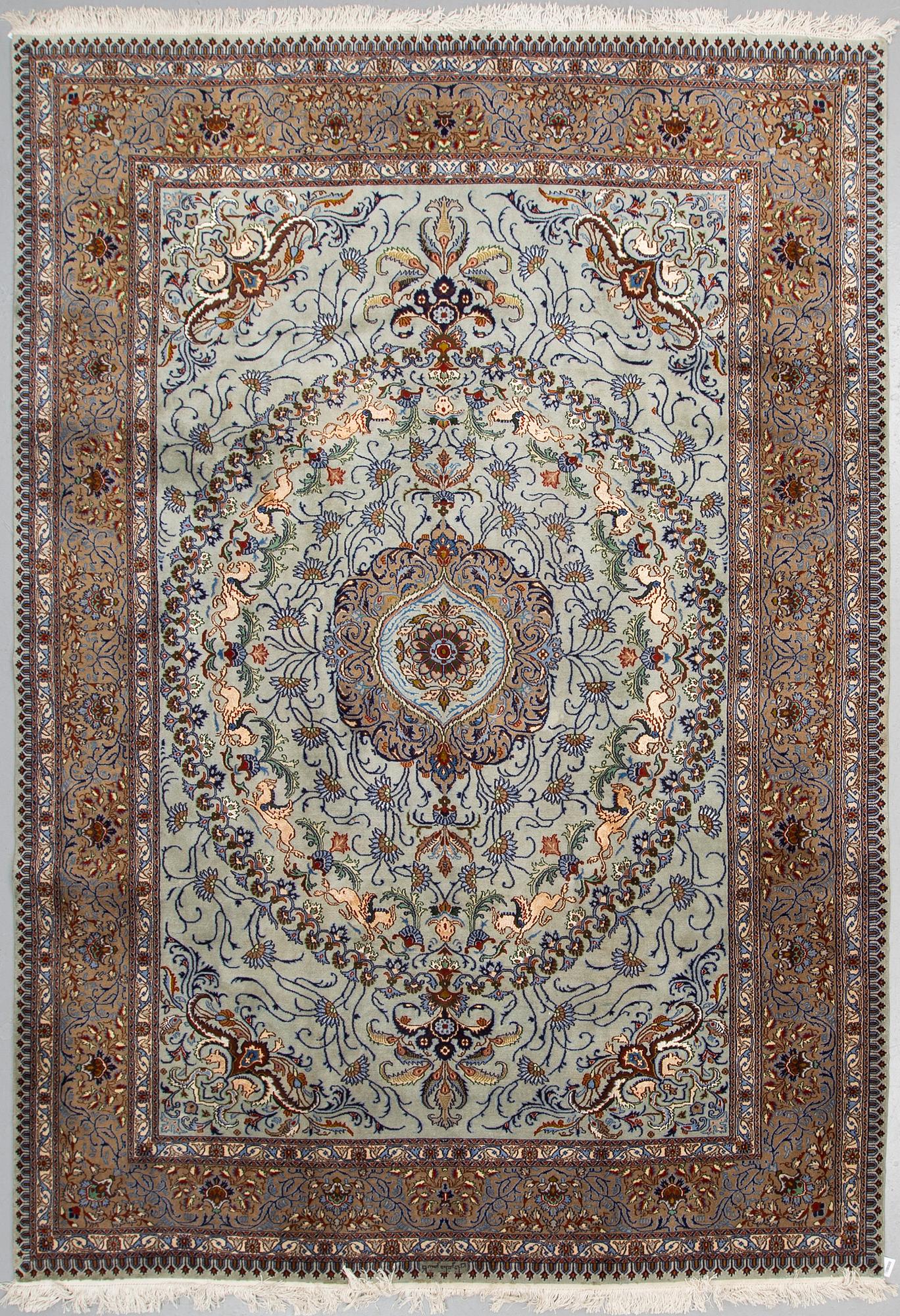 A CARPET, Kashmar, part silk, signed Mosafar Khan, around 344 X 241.