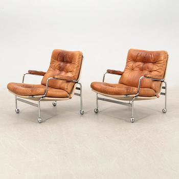 Bruno Mathsson, a pair of "Karin" armchairs for Dux, late 20th century.