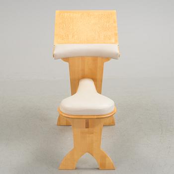 a "plugghästen" chair by Peter Lind.