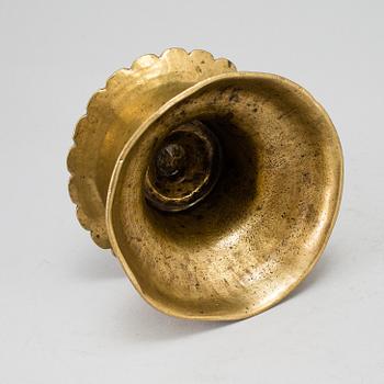 A 16th century bronze candlestick.