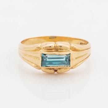 18K gold and greenblue stone ring.