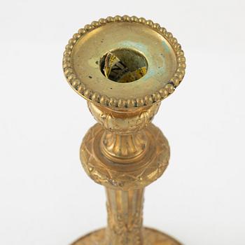 A pair of bronze candle sticks, 20th Century.