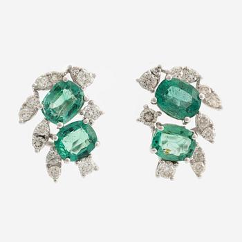 Earrings with emeralds and brilliant-cut diamonds.