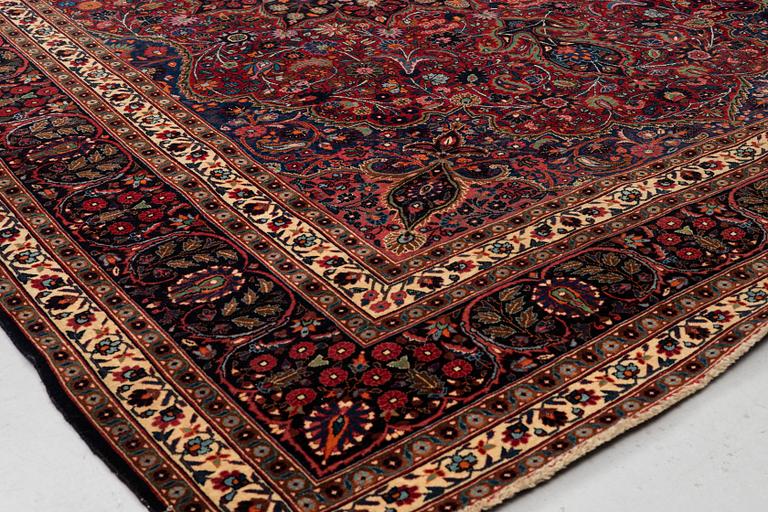 A carpet, semi-antique Mashad/Moud, ca 292 x 214 -218 cm.