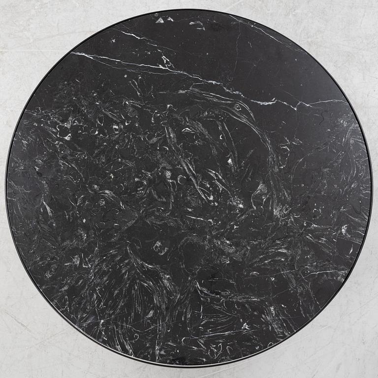 A marble top coffe table by Ferm Living, Denmark.