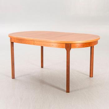 A Nils Jonsson teak and walnut 1960s dining table.