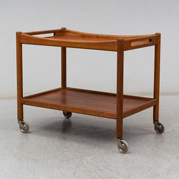 A signed tea trolley by Hans J Wegner for Andreas Tuck, Denmark, mid 20th century.