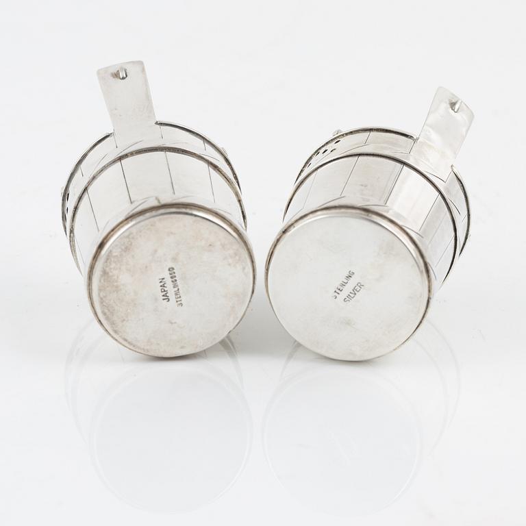 A pair of sterling silver salt- and pepper shakers , Japan, second half of the 20th century.