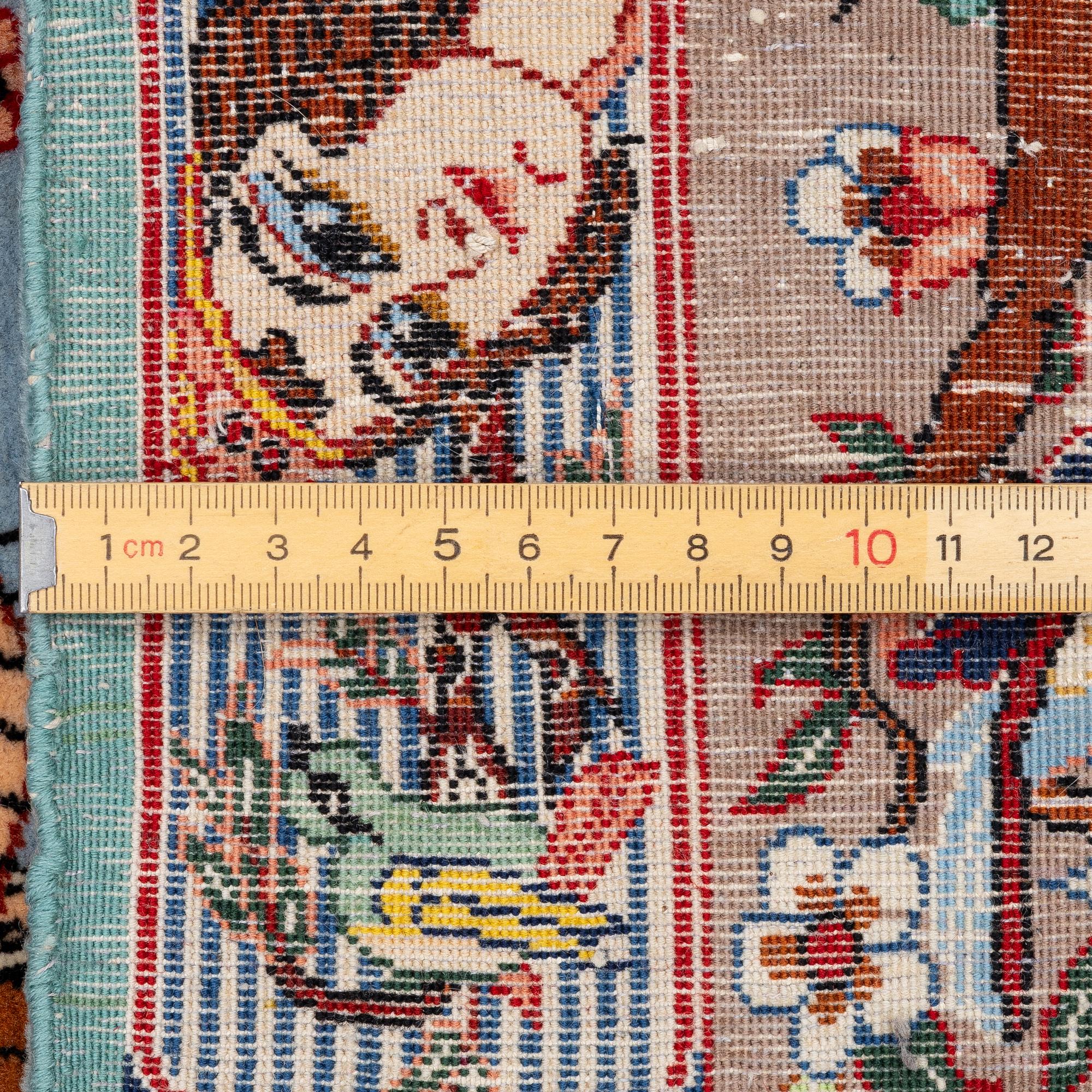 An Isfahan figural rug, c. 112 x 148 cm.
