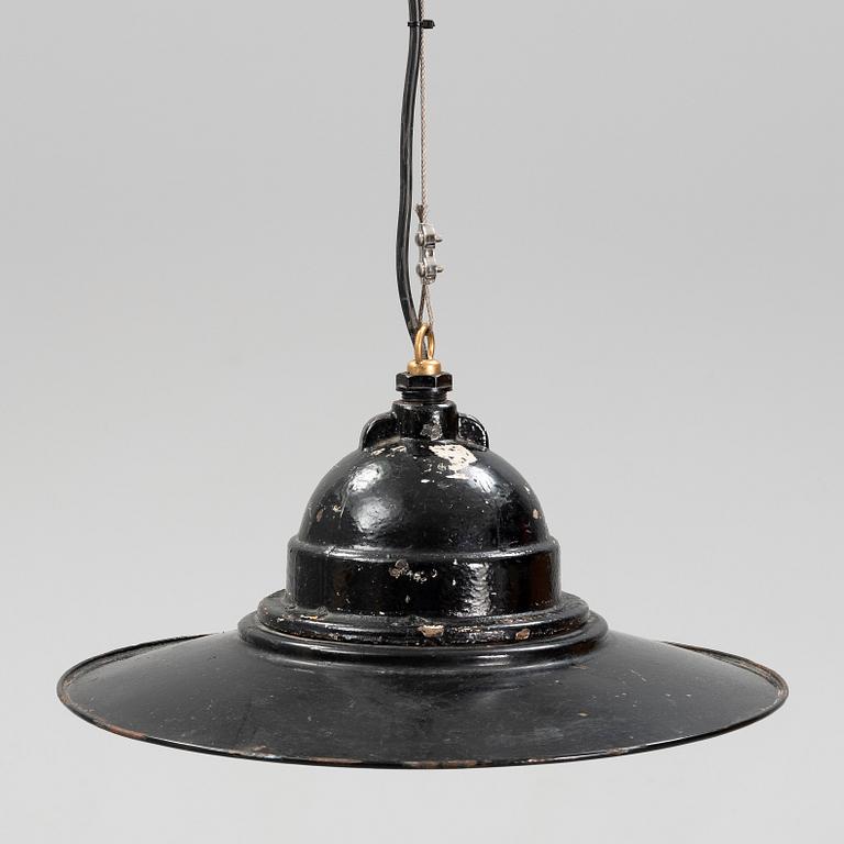 An early 20th century industrial lamp.