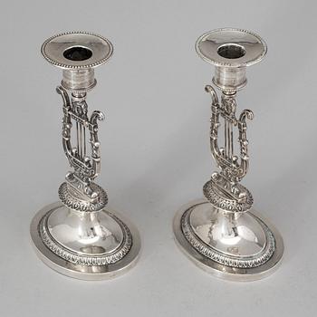 A pair of Swedish empire silver candlesticks by Adolf Zethelius, Stockholm 1826.