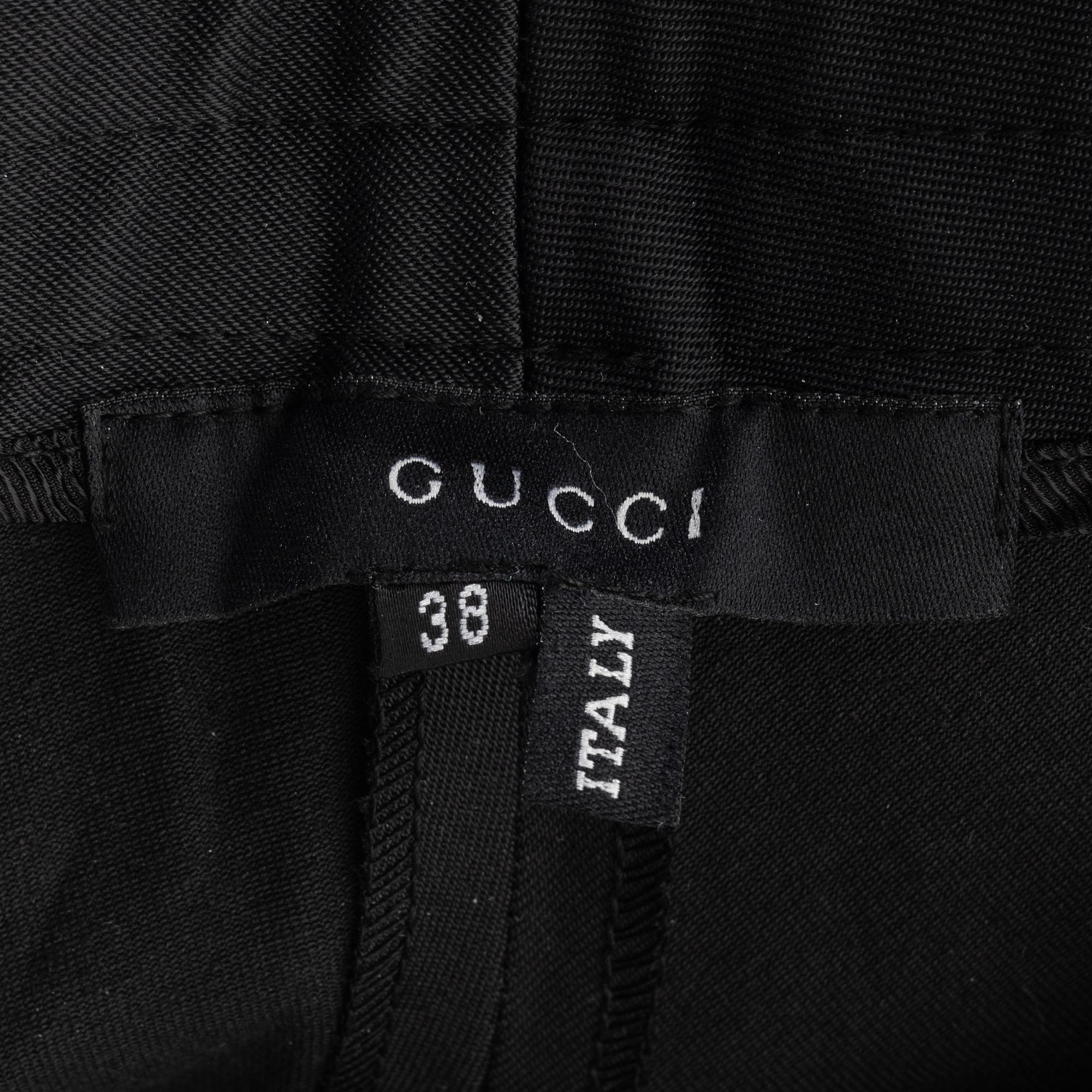 Gucci, a pair of black pants, size 38.