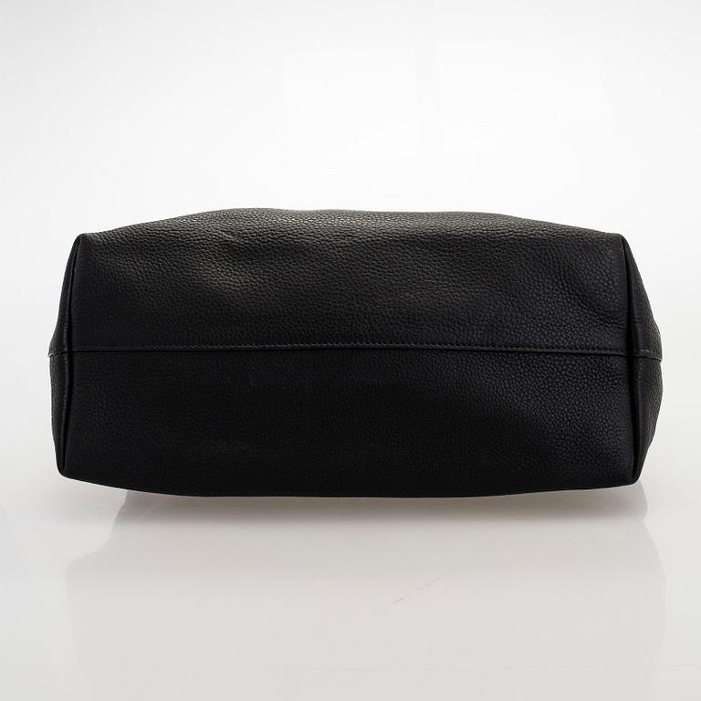 Prada, A 'Vitello Daino Tote' bag.