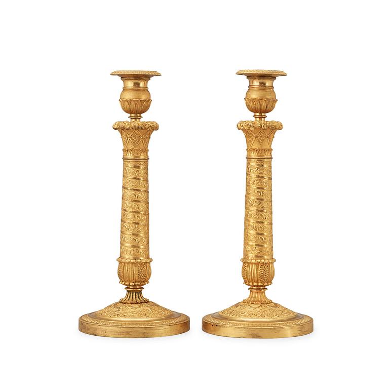 A pair of French Empire early 19th century candlesticks.