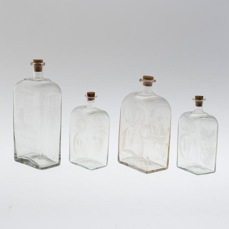 Four brandy bottles, 19/20th century.