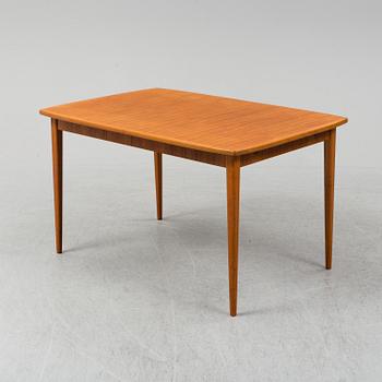 A second half of the 20th century teak veneered dining table.