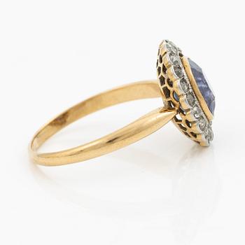 A ring in gold with a cushion-cut purple sapphire and old-cut diamonds, ca first half of the 20th century.