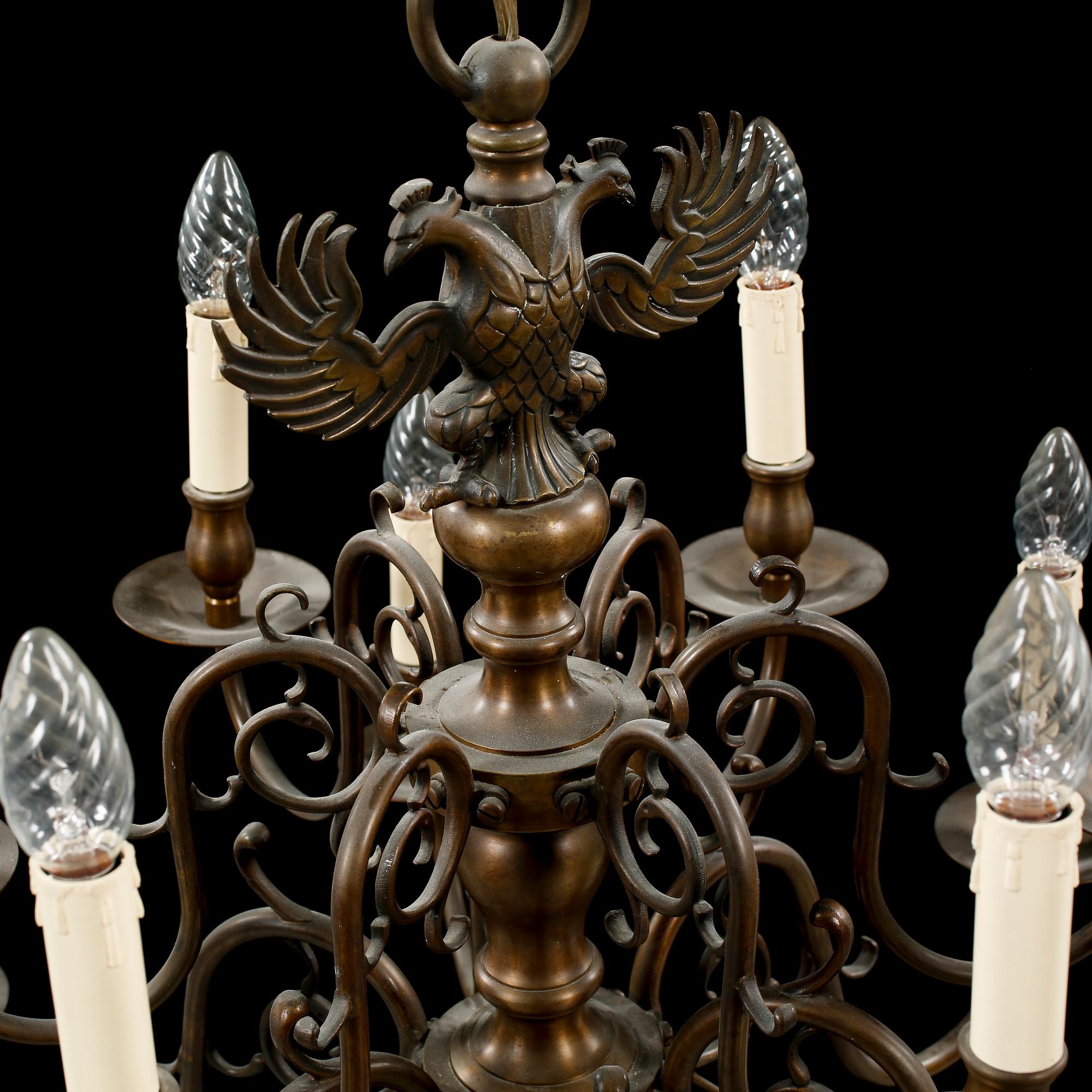 A patinated brass chandelier, first half of the 20th century. Height excl. chain ca 75 cm.