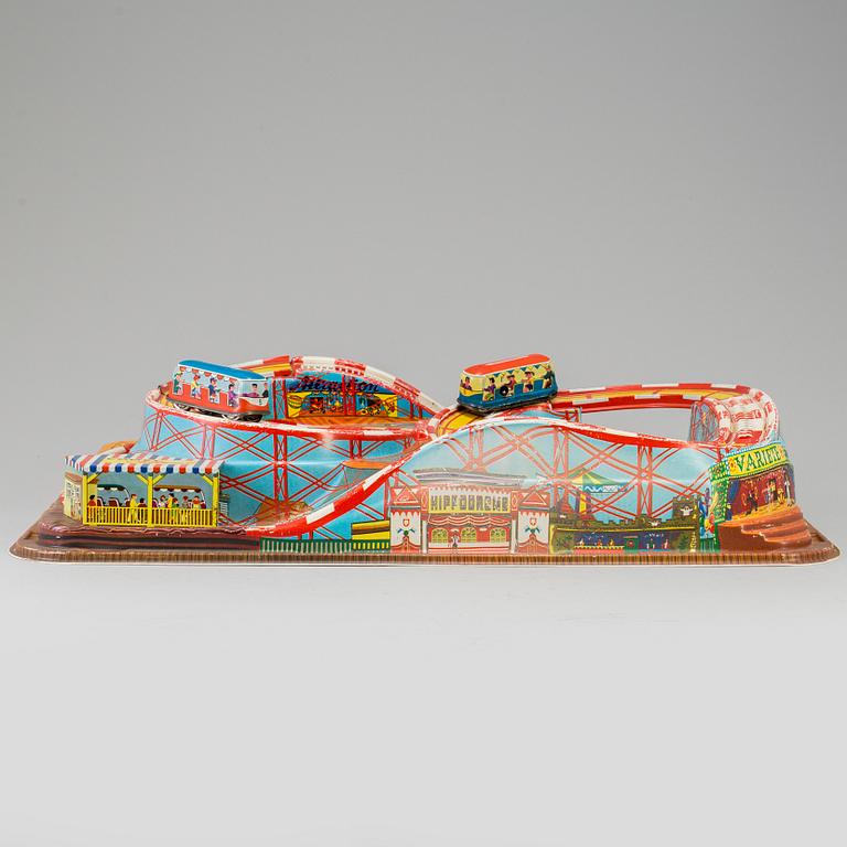 A 1960's  German toy car track with two mechanic buses.