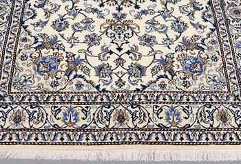 A rug, Nain part silk, ca 235 x 160 cm.