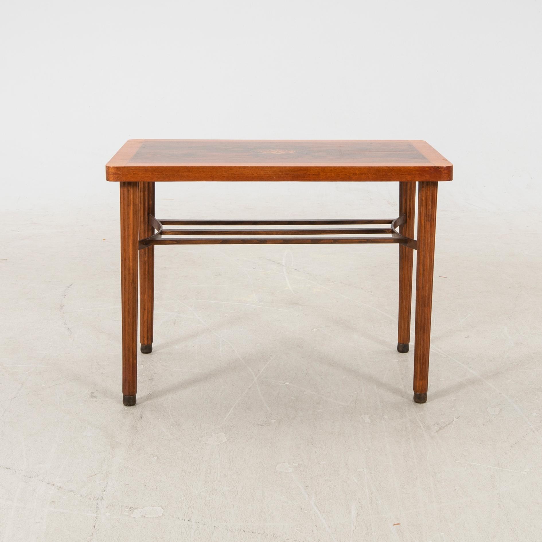 A 1940s walnut table. - Bukowskis