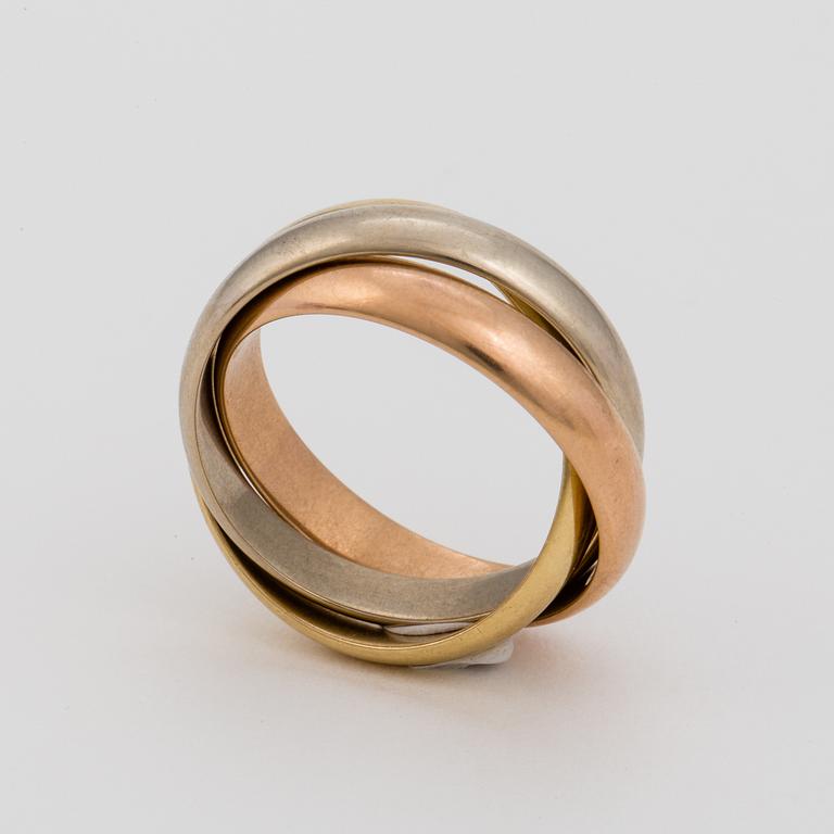 An 18K white, rose and yellow gold ring.