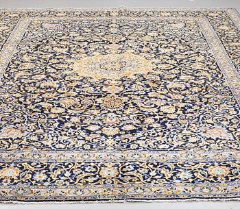 A CARPET, Kashan, signed ca  365 X 277 cm.