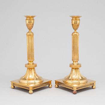 A pair of Skultuna brass candlesticks, No 71, early 20th Century.