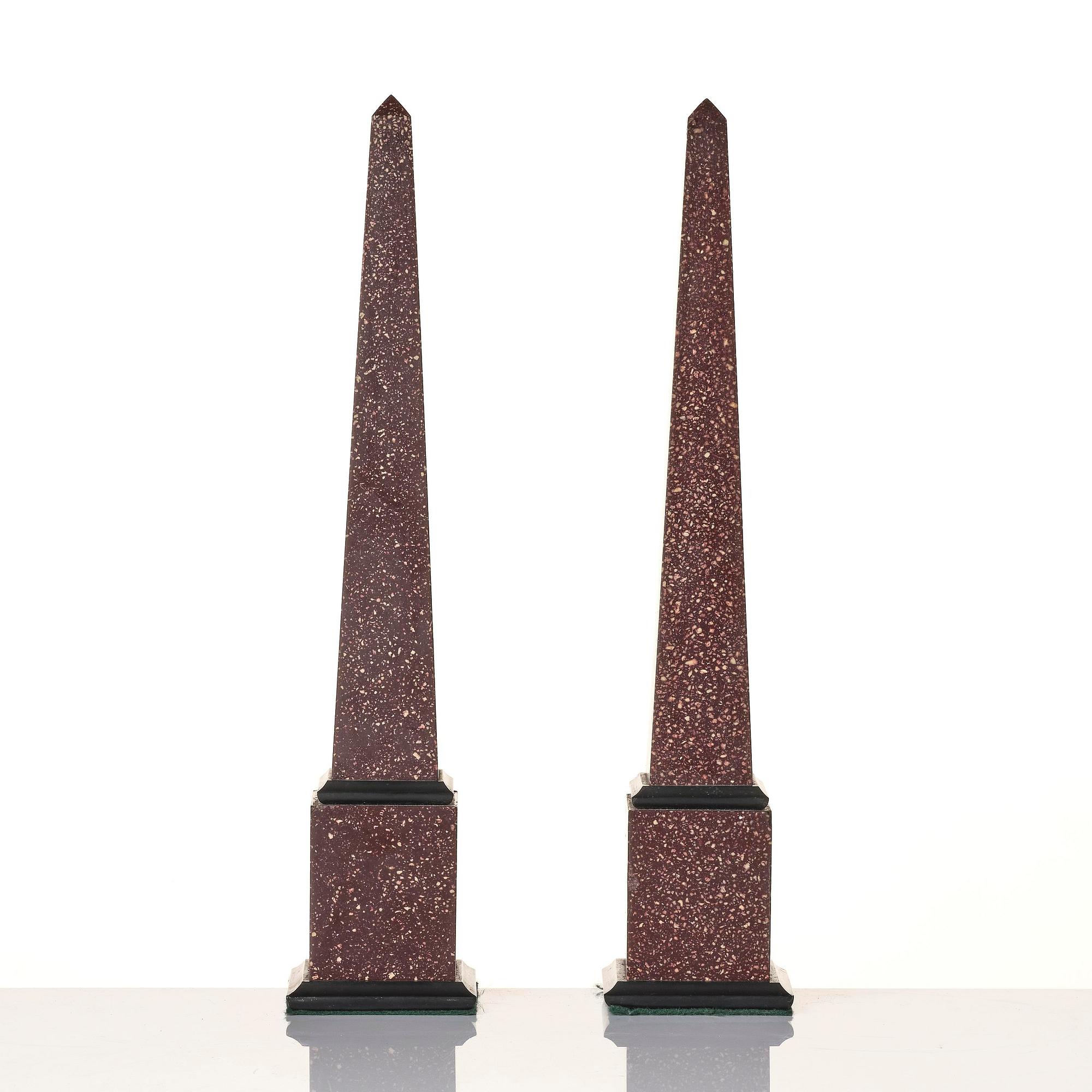 A pair of Egyptian porphyry obelisks 20 th century.