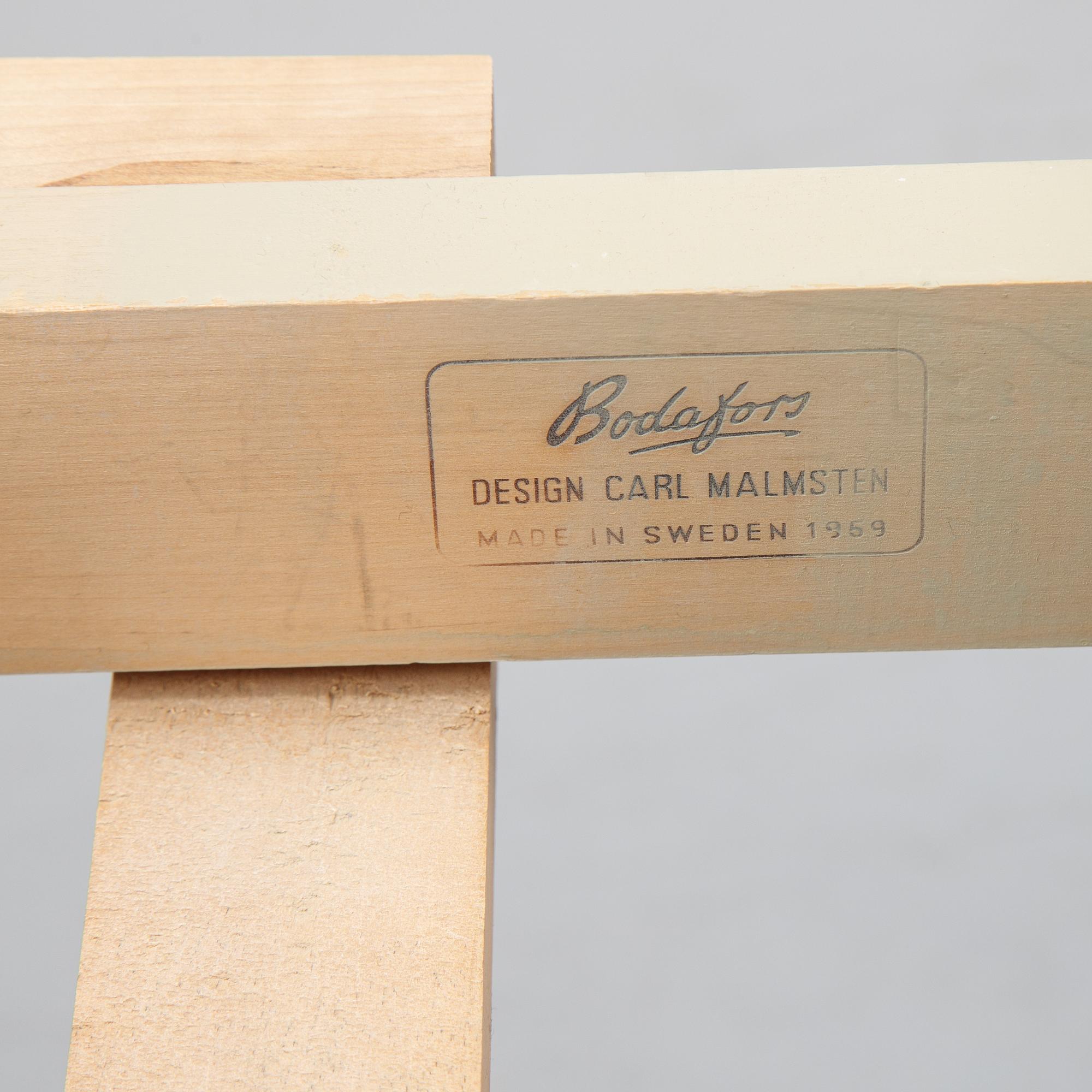 A dining table with six chairs by Carl Malmsten, second half of the 20th Century.