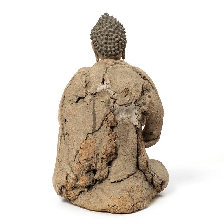 A Southeast Asian figure of a Buddha, 20th century.